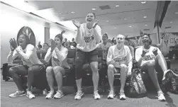  ?? PATRICK BREEN/THE REPUBLIC ?? ASU's Charnea Johnson-Chapman, from left, Kianna Ibis, Sabrina Haines, Courtney Ekmark and Sophia Elena react with the rest of their team after being announced as a No. 7 seed in NCAA tournament play on Monday.