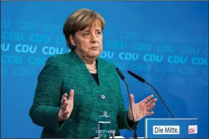  ?? AP/BERND VON JUTRCZENKA ?? German Chancellor Angela Merkel speaks after a board meeting of her Christian Democratic Union party in Berlin on Sunday.