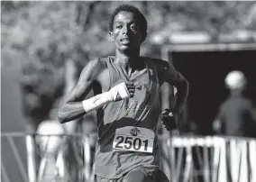  ?? Charlie Blalock/Contributo­r ?? Jefferson’s Henok Hayele, who began running as a sport only seven months ago, surprised himself after finishing fifth: “I didn’t expect to see myself being here.”