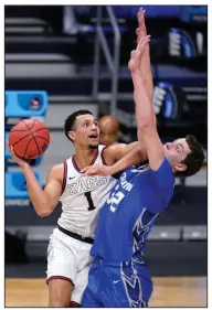  ?? (AP/Michael Conroy) ?? Freshman Jalen Suggs is part of the nation’s top offense at Gonzaga, which is averaging 91.6 points per game. The Bulldogs (30-0) face UCLA in the Final Four today at Lucas Oil Stadium in Indianapol­is.