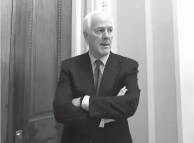  ?? Associated Press file photo ?? n Senate Majority Whip John Cornyn of Texas pauses June 26 as he speaks to reporters outside his office on Capitol Hill in Washington.