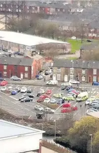  ??  ?? ●●Emergency services at Aldi in Rochdale after the boy suffered a cardiac arrest