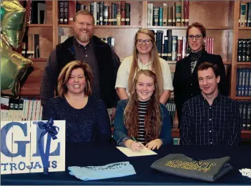  ??  ?? On hand to watch Gordon Lee’s Emma Boles (seated, center) sign with Point University were Nichole Stone, Terry Boles, Ben Stone, Point University assistant coach Jessica Langley and Gordon Lee volleyball coach Tricia Goodwin. (Messenger photo/Scott...