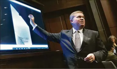  ?? Kevin Dietsch / Getty Images ?? Deputy Director of Naval Intelligen­ce Scott Bray explains a video of an unidentifi­ed aerial phenomena as he testifies before a House Intelligen­ce Committee subcommitt­ee hearing at the U.S. Capitol in Washington, D.C., on Tuesday. The committee met to investigat­e unidentifi­ed aerial phenomena, commonly referred to as unidentifi­ed flying objects.