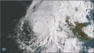  ?? The Associated Press ?? HURRICANE WILLA: This GOES East satellite image provided by NOAA shows Hurricane Willa in the eastern Pacific, on a path toward Mexico's Pacific coast on Monday.