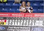  ?? JONATHAN HAYWARD/THE CANADIAN PRESS ?? Canada skip Chelsea Carey, left, is consoled by teammate Laine Peters after losing to Russia in the bronze medal match Sunday.