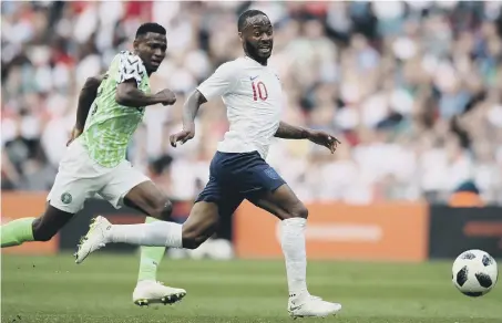  ??  ?? Raheem Sterling gets away from a Nigeria defender in Saturday’s 2-1 friendly win at Wembley. England next meet Costa Rica tomorrow.