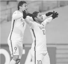  ??  ?? This picture taken on Feb 21, 2017 shows Shanghai SIPG FC’s Brazilian forward Hulk (right) celebratin­g his goal against FC Seoul during their AFC Champions League group F football match in Seoul. — AFP photo