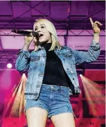  ??  ?? RaeLynn performs at the free “Blake & Friends” concert Blake Shelton co-hosted Saturday in his adopted hometown of Tishomingo.