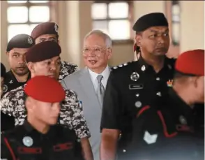  ?? — Filepics/the Star ?? A party divided? najib (left) has support among umno grassroots and ahmad Zahid’s affidavit in support of house arrest for the former umno president could be an acknowledg­ement of that influence.