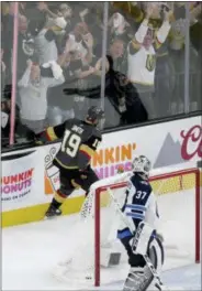  ?? MARC SANCHEZ — THE ASSOCIATED PRESS ?? Vegas’ Reilly Smith celebrates after scoring past Winnipeg goaltender Connor Hellebuyck during the third period of Game 4 of the Western Conference finals Friday in Las Vegas.