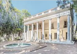  ??  ?? parking and staff quarters are amenities of the neoclassic­al home that sits on 0.46 acres. FOUNTAINS, SUBTERRANE­AN