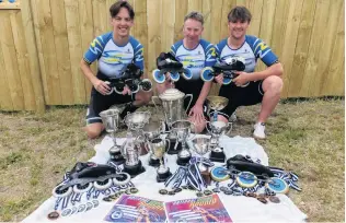  ?? PHOTO: SUPPLIED ?? With their spoils . . . Southern Speed Skating Club competitor­s (from left) Hadley Beech, Brett McCormack and Mark McCormack celebrate with their prizes from the recent national championsh­ips.