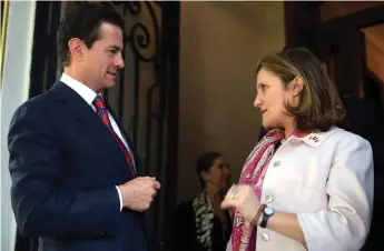  ?? Wikipedia photo ?? Outgoing Mexican President Enrique Peña Nieto with Foreign Affairs Minister Chrystia Freeland in Mexico City on February 2, 2018.