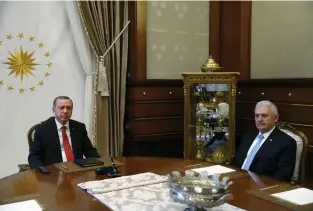  ?? (Reuters) ?? TURKISH PRESIDENT Recep Tayyip Erdogan (left) meets with Prime Minister Binali Yildirim in Ankara yesterday.