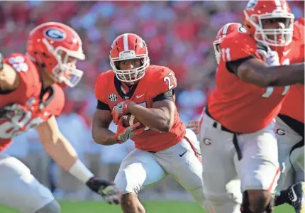  ??  ?? Georgia’s Nick Chubb (27) didn’t put up All-American numbers and wasn’t part of the Heisman conversati­on, but that was part of the plan to save wear and tear on the running back. DALE ZANINE/USA TODAY SPORTS