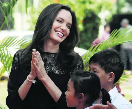  ?? Heng Sinith / AP Photo ?? Jolie adopted her first child, Maddox, from an orphanage in Cambodia’s western Battambang province in 2002.