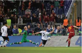  ??  ?? Edin Dzeko scores AS Roma’s second goal against Liverpool during their UCL semifinal second leg in Rome on Wednesday. — Reuters