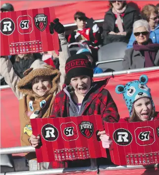  ?? JEAN LEVAC/ OTTAWA CITIZEN ?? Keaira Eber, left, Eliza Reggler and Hazel Reggler, fans of the Ottawa Redblacks, were among the happy spectators who attended team practice at TD Place on Friday afternoon.