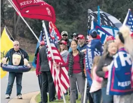  ?? EVANVUCCI/AP ?? Supporters of President Donald Trump wait for him to depart Trump National Golf Club on Sunday in Sterling, Va.