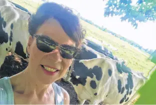  ??  ?? Not sure if the girls minded getting in on the selfie. I was sitting in my favourite chair on the old veranda when I noticed the cows enjoying a little shade along the fence.