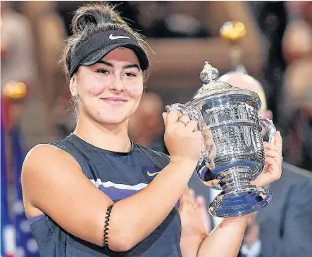  ?? REUTERS ?? Canada’s Bianca Andreescu with the US Open championsh­ip trophy after beating Serena Williams of the USA in the women’s singles in September 2019.