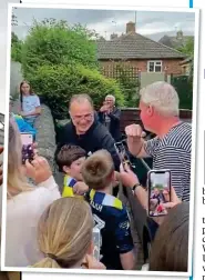  ??  ?? HERO WORSHIP: Bielsa is greeted by fans outside his house yesterday, while hundreds of others gathered outside Elland Road to celebrate promotion