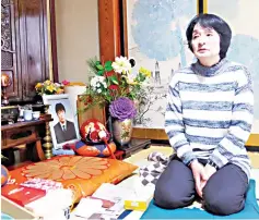 ??  ?? Taeko Watanabe, whose son Yuki committed suicide in 2008, talks in front of his portrait at her home in Akita. — Reuters photo