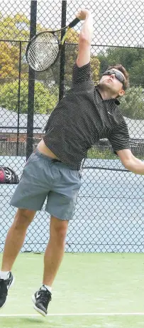  ??  ?? Matt Warry serves during round nine of Riverside tennis.