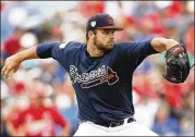  ?? MICHAEL REAVES / GETTY IMAGES ?? Braves starter Bryse Wilson pitched four scoreless innings against the Cardinals on Tuesday. Wilson allowed one hit while striking out five and walking one in a 5-0 Braves win.