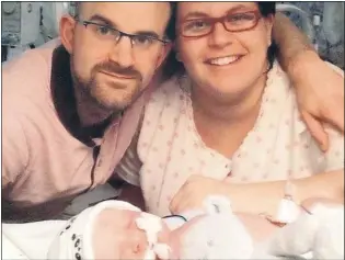  ??  ?? Parents Adam Asquith and Sarah Ellis with baby Gino who sadly did not survive