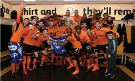  ?? Photograph: Sam Bagnall - AMA/Getty Images ?? Wolves players celebrate promotion after beating Birmingham City at Molineux.