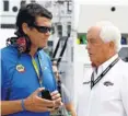  ?? JEFF ZELEVANSKY, GETTY IMAGES ?? Waltrip, left, talking Aug. 12 with Roger Penske, says team ownership has been a labor of love.