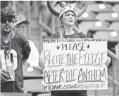  ?? SHANNA LOCKWOOD, USA TODAY SPORTS ?? A fan holds a sign before Sunday’s game between the Houston Texans and the Tennessee Titans in Houston.