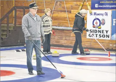  ?? ERIC MCCARTHY/JOURNAL PIONEER ?? Harvey Holm calls a shot on one ice while fellow Alberton stick curler Audrey Callaghan watches as Cornwall curler Gloria Clarke calls a shot on an adjacent sheet of ice. Stick curlers, when they are playing skip, can sweep from their hog line in....