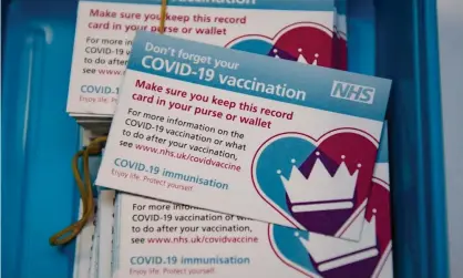  ?? Photograph: Getty Images ?? NHS Covid-19 vaccinatio­n cards. ‘Issuing individual­s with a licence to mingle would be counterpro­ductive if it means the collective guard goes down.’