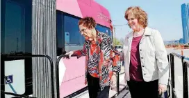  ?? [PHOTO BY JIM BECKEL, THE OKLAHOMAN ARCHIVES] ?? Edna Tims, 102, is helped onto a new Oklahoma City streetcar by her daughter, Madelyn Campbell, during a recent open house. The streetcars soon will be making test runs on city streets.