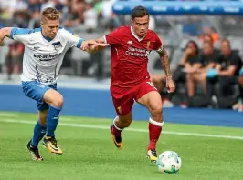  ?? HANNIBAL HANSCHKE ?? Liverpool are determined to hold on to star midfielder Philippe Coutinho.