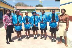  ?? ?? Mrs Tabeth Matombo-Muputa (left) and Mrs Chipo Kanyimo-Gwangwadze pose for a photograph with the students who were granted scholarshi­ps by The Angel of Hope Foundation. The students are (from left) Nicole Garwe, Shalom Chisadza, Trishy Chiriseri and Florence Mariwo