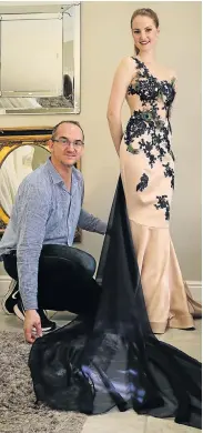  ?? Picture: WERNER HILLS ?? ALL AFLUTTER: Jason Kieck adjusts the hem of Adria van der Merwe’s peacock themed dress for the entertainm­ent gala ‘Whispers of the Orient’ in Johannesbu­rg this weekend