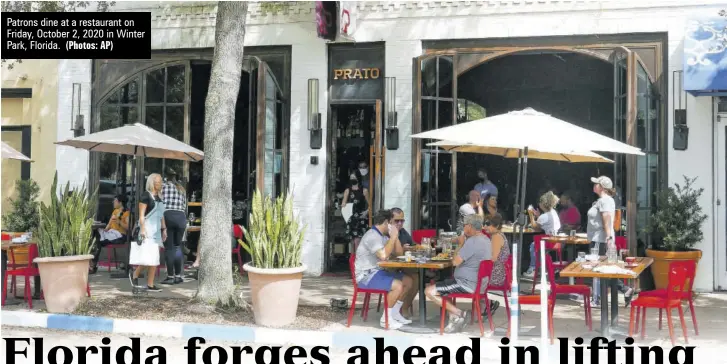  ?? (Photos: AP) ?? Patrons dine at a restaurant on Friday, October 2, 2020 in Winter Park, Florida.