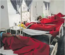  ?? THE ASSOCIATED PRESS ?? Women who underwent sterilizat­ion surgery receive treatment at District Hospital in Bilaspur, India, last week.