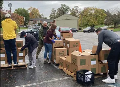  ?? PHOTO COURTESY PAULA SCHAFER ?? Volunteers at Upper Merion Area Community Cupboard in King of Prussia unload pallets of USDA Farmers to Families produce boxes provided by Seashore Fruit & Produce Company of Vineland, N.J.