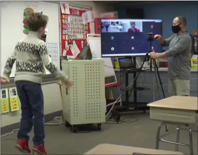  ?? IMAGE FROM SCREENSHOT ?? North Penn School District is even using its 50-inch screens to conduct physical education classes both in the classroom and at home.