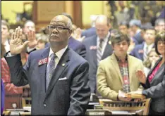  ?? BOB ANDRES /BANDRES@AJC.COM ?? Lawmakers take the oath of office in the House, including Rep. Calvin Smyre, D-Columbus. The opening day of the legislativ­e session Monday was largely ceremonial, with House and Senate members electing their leaders.