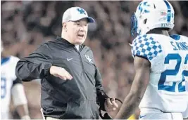  ?? SEAN RAYFORD/AP ?? Kentucky coach Mark Stoops has the Wildcats undefeated at 3-0 and hopeful about ending the nation’s longest losing streak against one team.