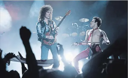  ?? ALEX BAILEY TWENTIETH CENTURY FOX ?? Gwilym Lee, left, and Rami Malek jamming out onstage as members of Queen, in a scene from “Bohemian Rhapsody.”