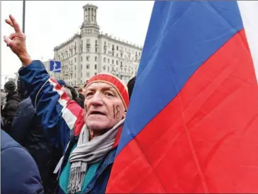  ?? MLADEN ANTONOV/AFP ?? A supporter of opposition leader Alexei Navalny takes part in a rally calling for a boycott of the March 18 presidenti­al elections, in Moscow, yesterday.