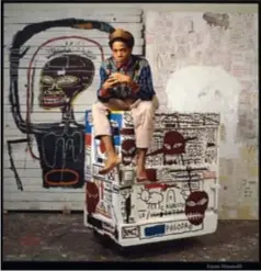  ??  ?? The late Jean-Michel Basquiat pictured in his studio with Flexible (1984), which sold for US$45.3 million at Phillips inNew York in May.