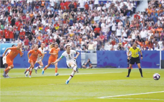  ?? Maja Hitij / Getty Images ?? Megan Rapinoe of the U.S. executes a perfect penalty kick to score the first goal for the Americans, who defeated the Netherland­s 20 to win the World Cup.